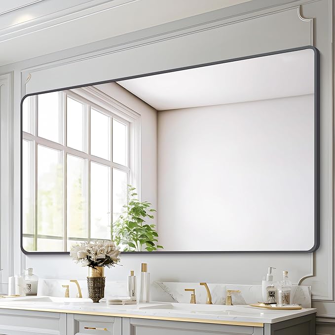 full-wall mirror above the vanity